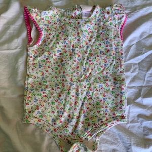 A floral Onsie with sleeve detail.